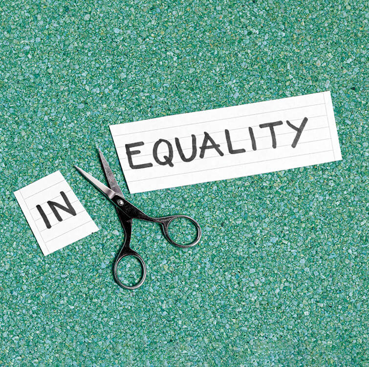 A banner with the text "In" & "Equality" cut in two by a scissor.